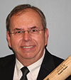 Photo of Russ Poulin with a bat.