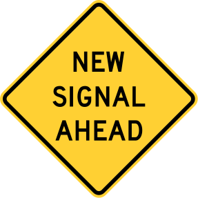 Warning sign that reads: "New Signal Ahead"