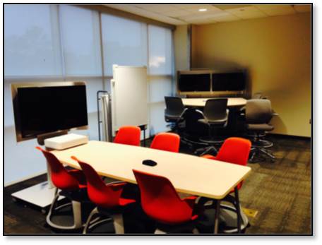 Photo of a group working space with televisions