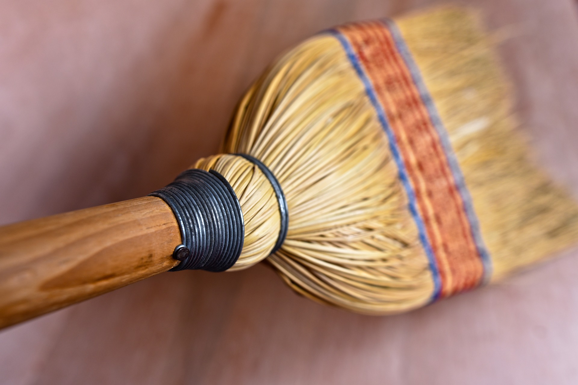 Looking down on a broom sweeping the floor