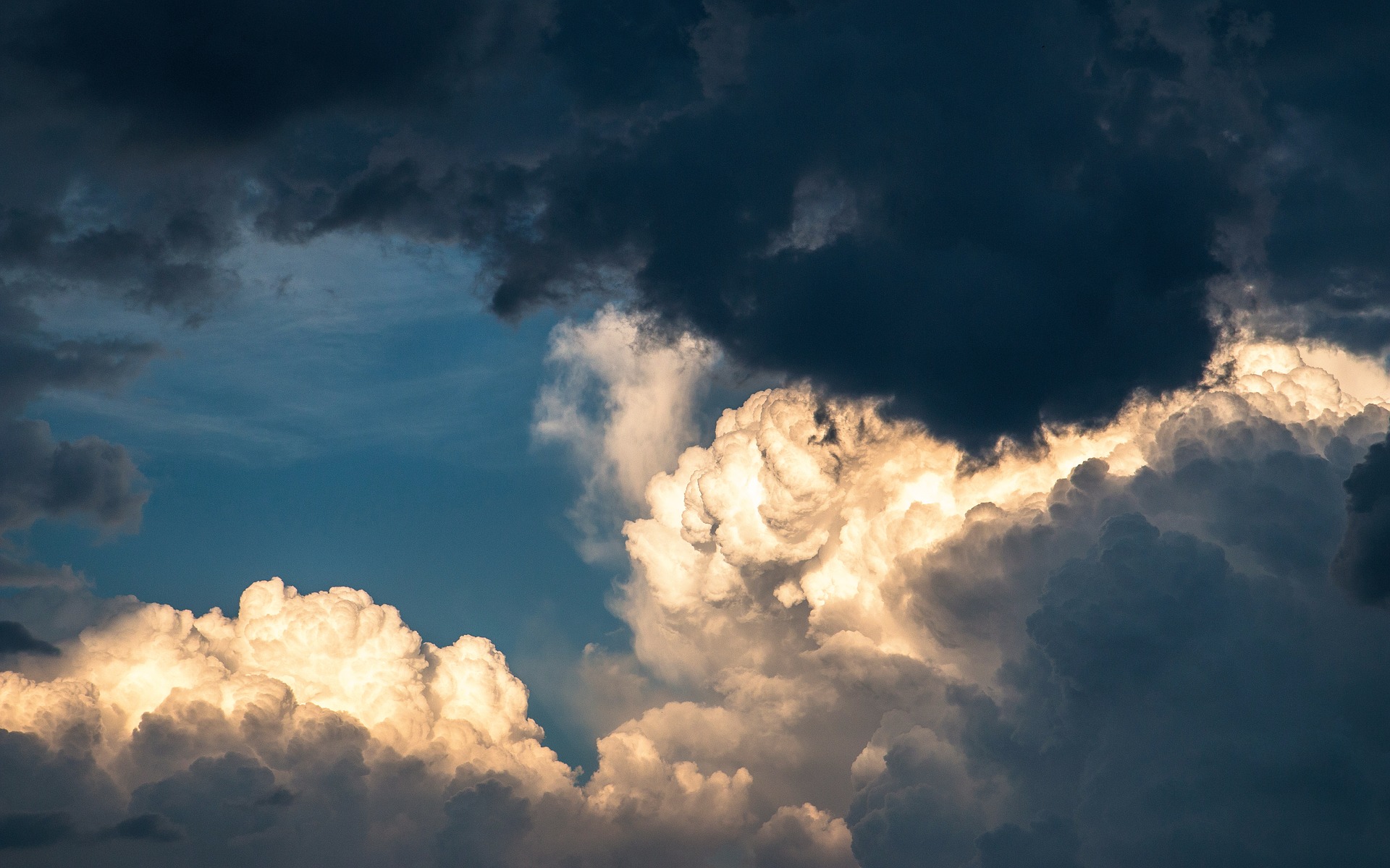 Light clouds and dark clouds meet in the sky