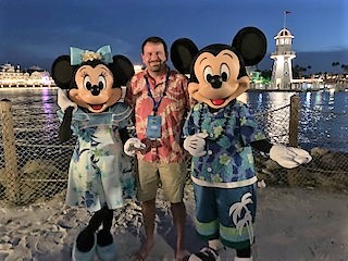 luke poses with Mickey and Minnie