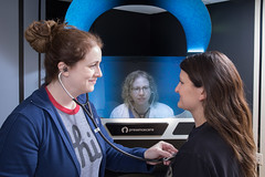 Picture of nursing student placing stethoscope on the chest of a 