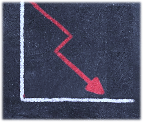 a declining arrow on a chalkboard