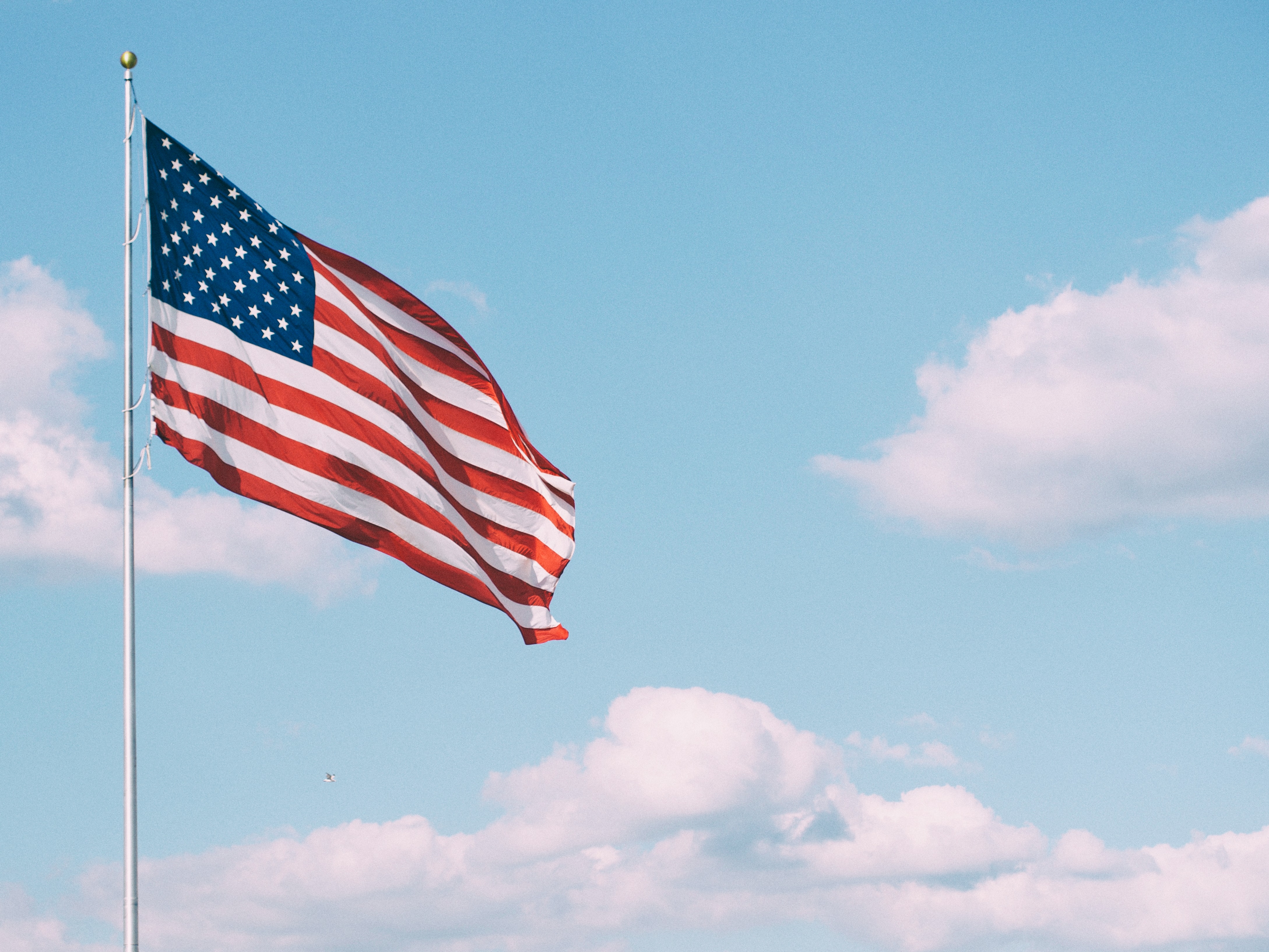 a flag with blue sky in the background