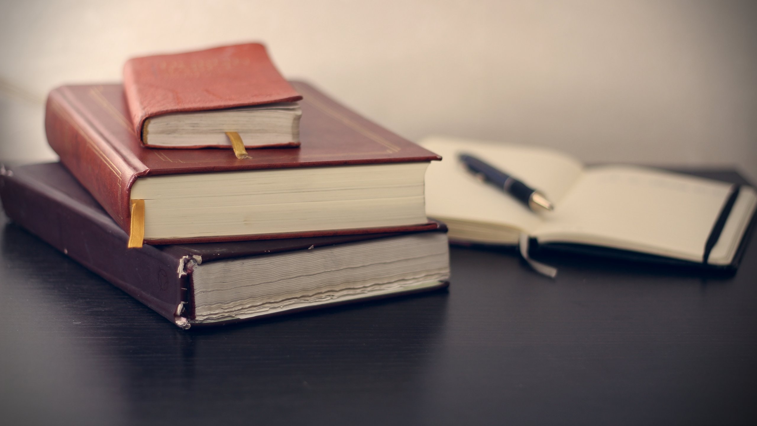 books in a stack on a desk