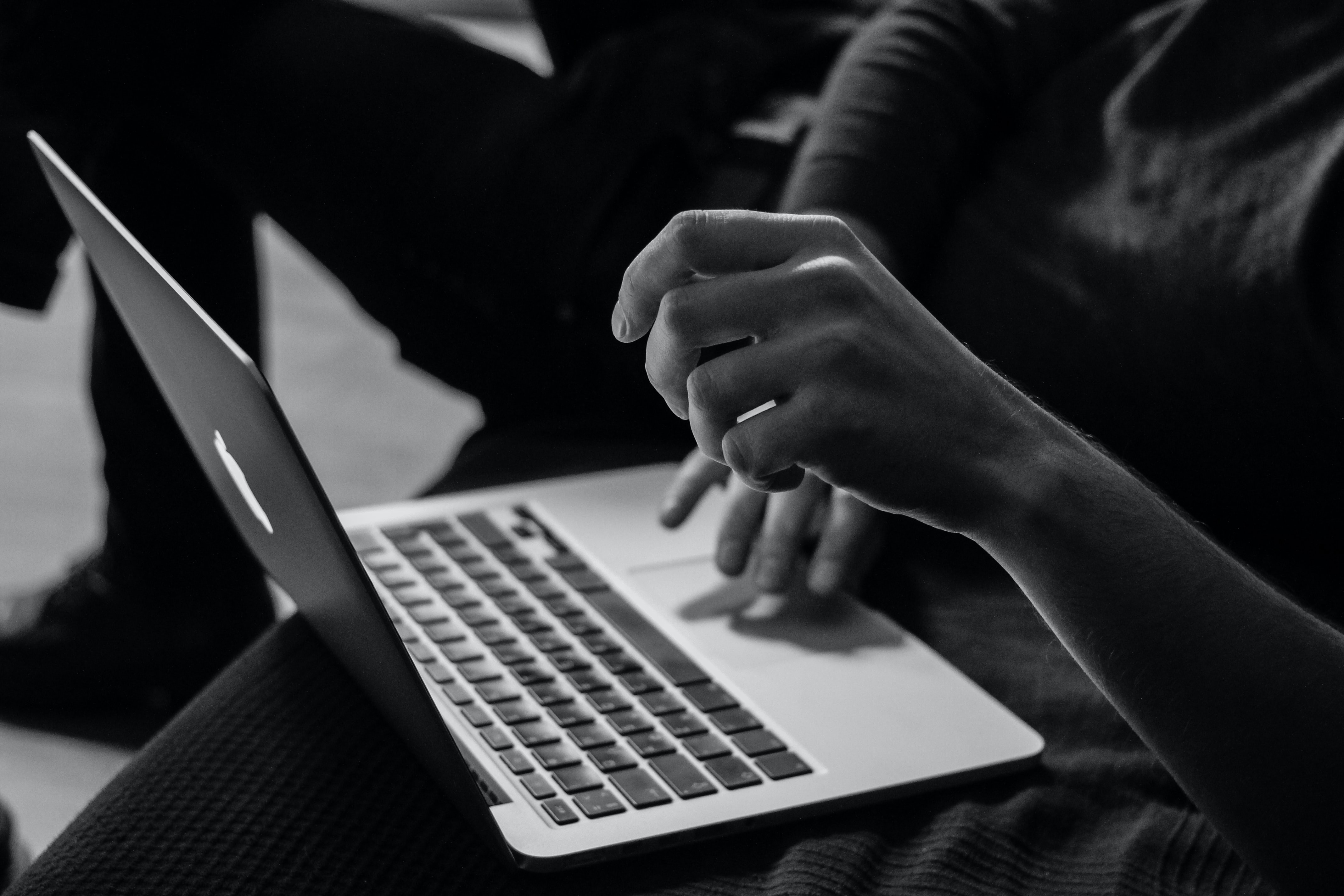 someone's hands using a laptop