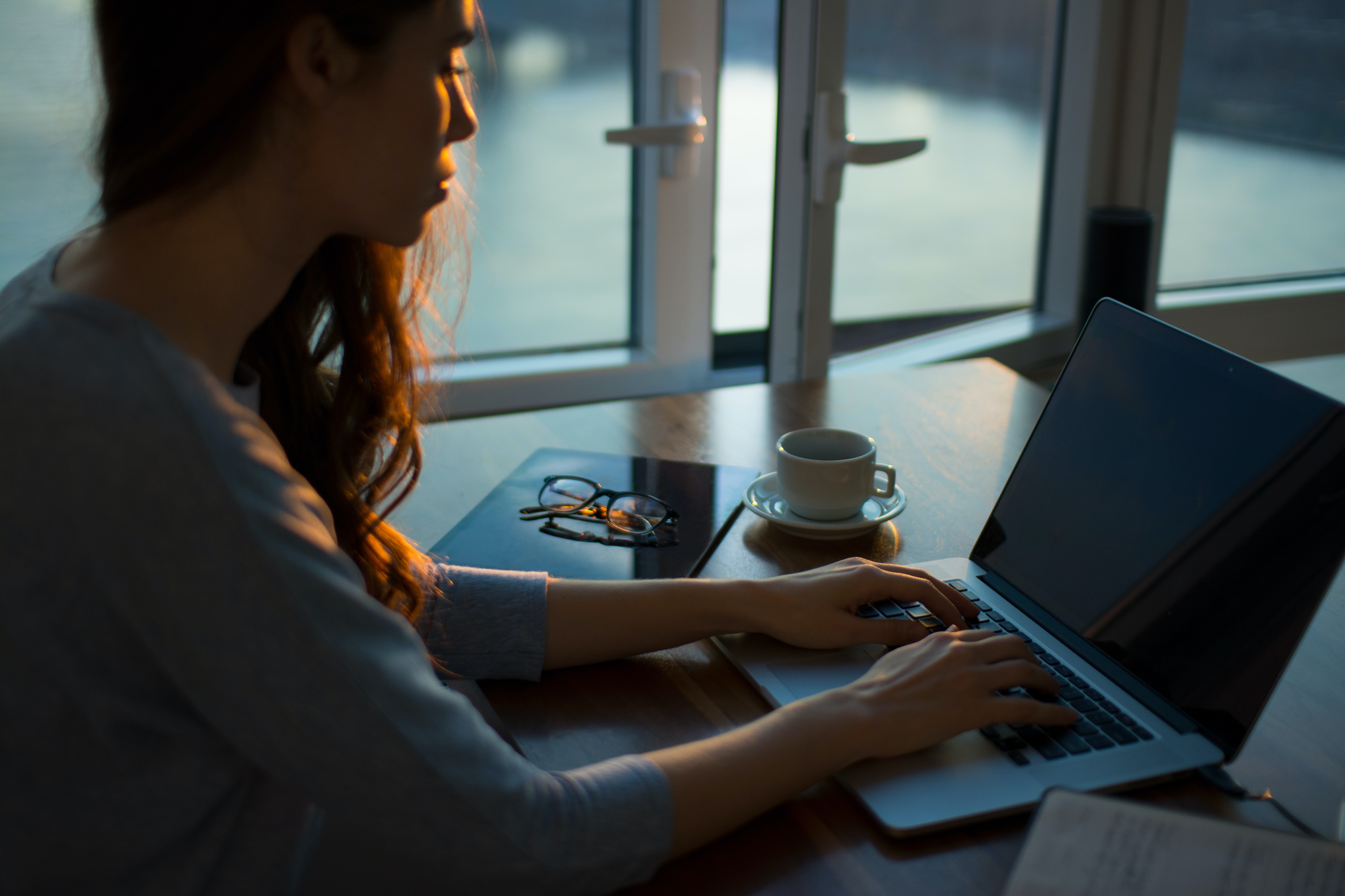 A woman working on a laptop