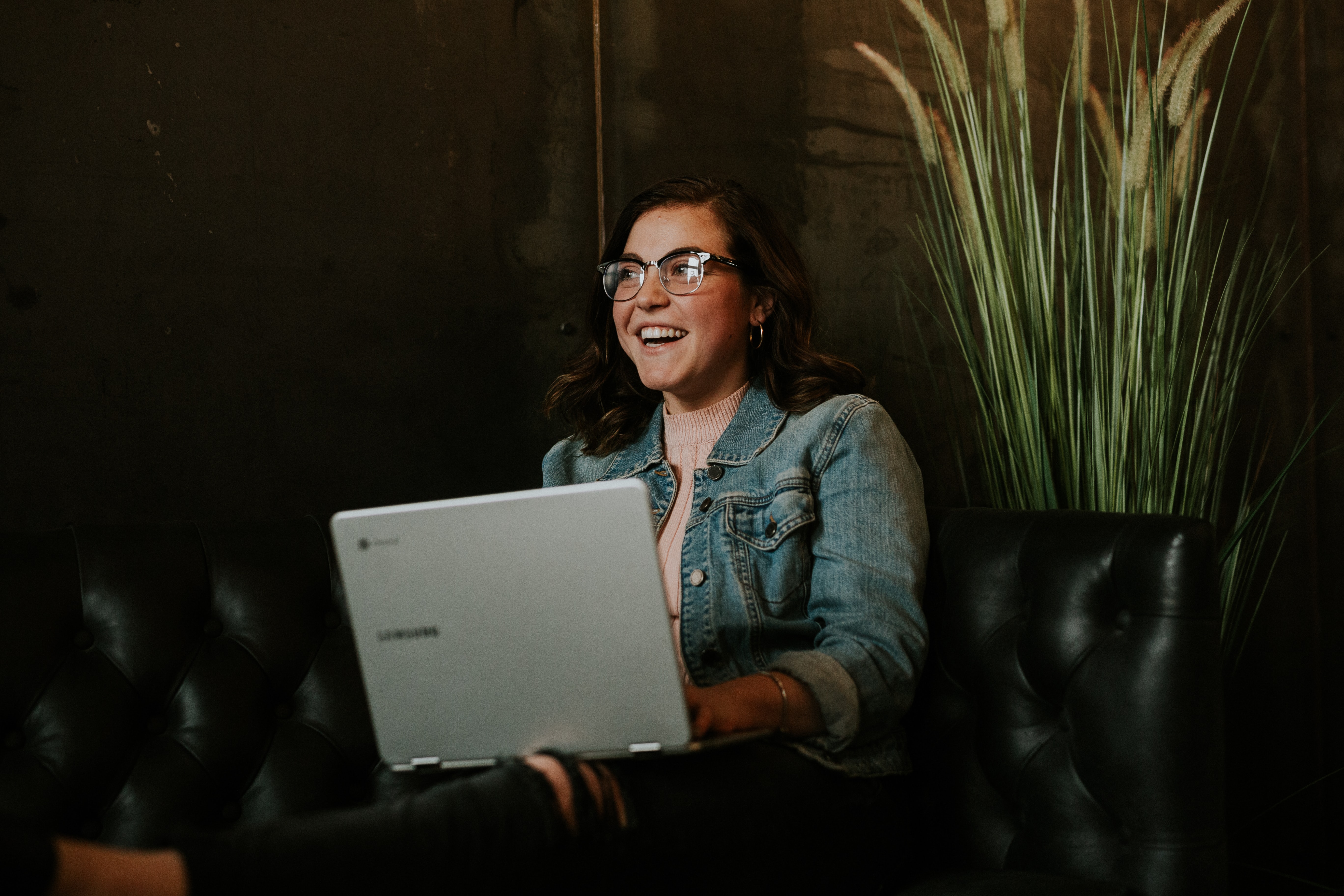 A woman holding a laptop