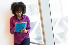 A woman holding a tablet