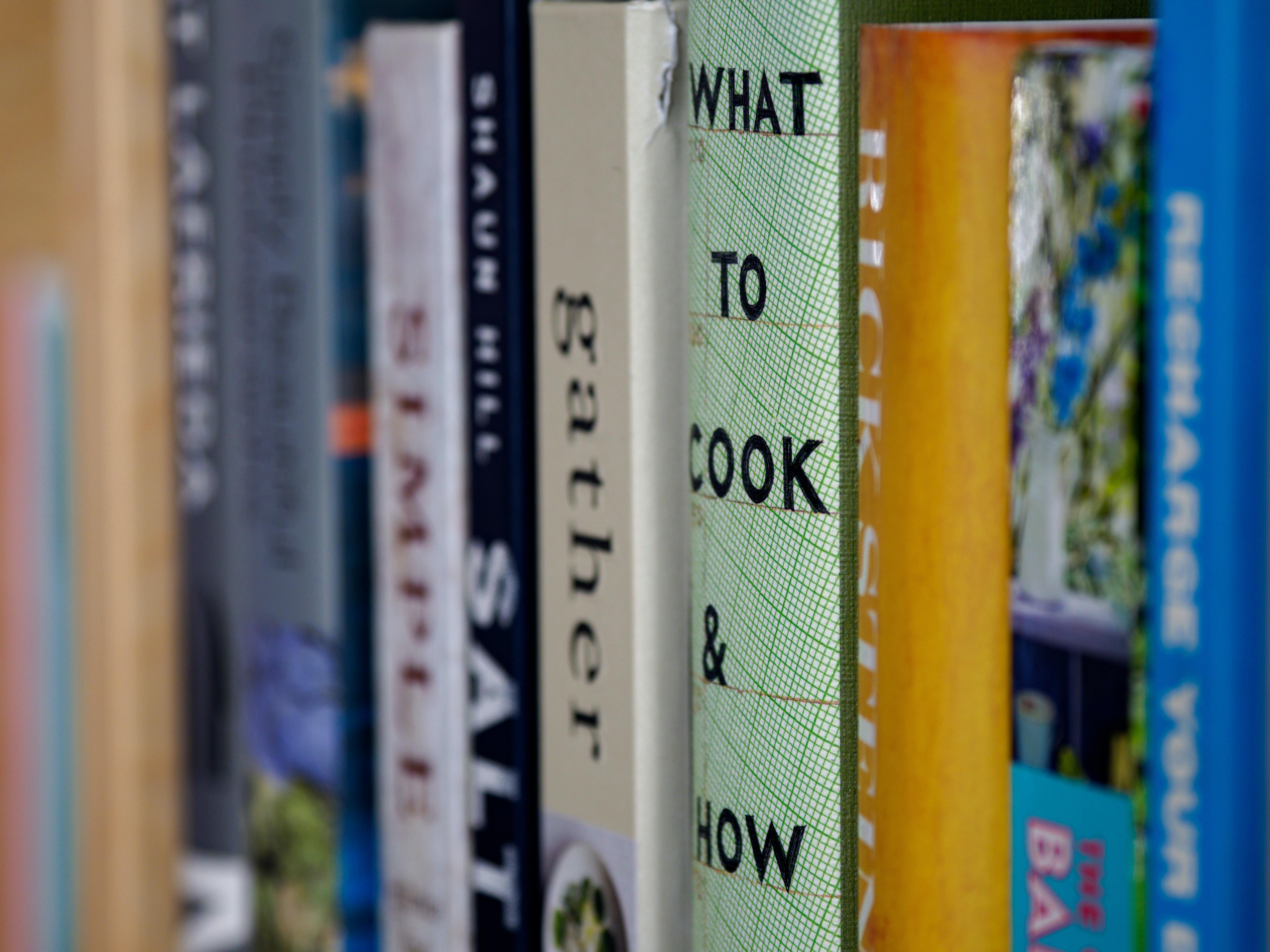 several cookbooks on a shelf