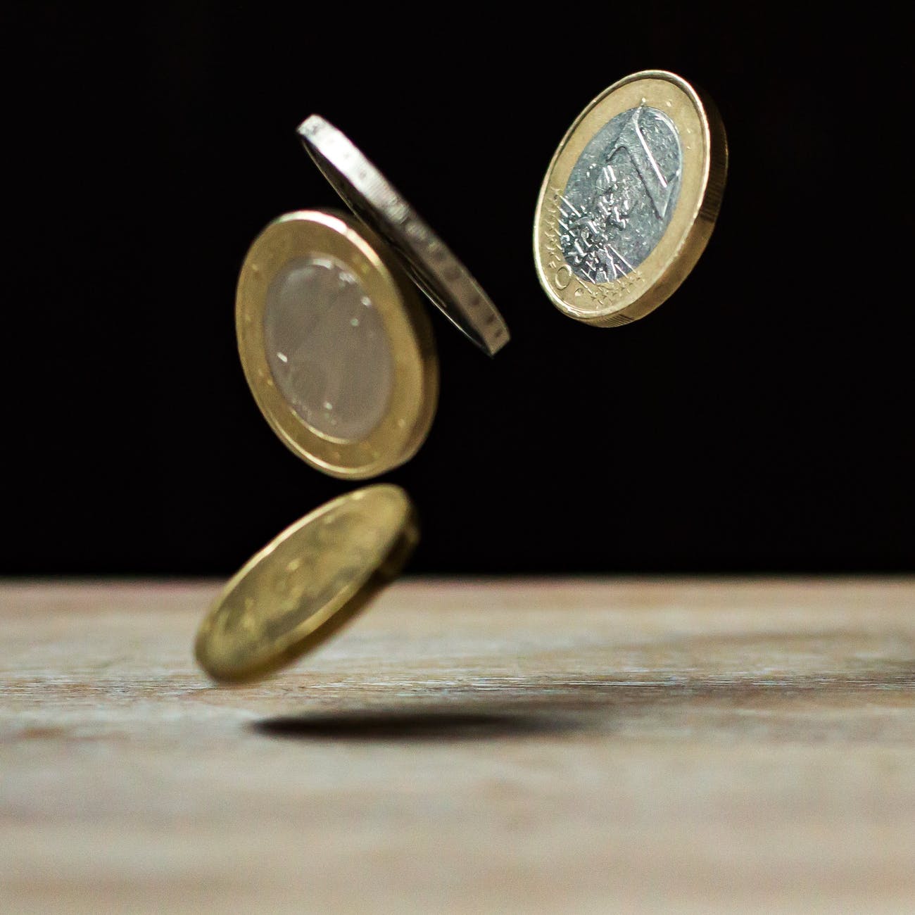 coins dropping on a table