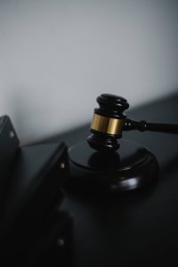 black gavel on table in courtroom