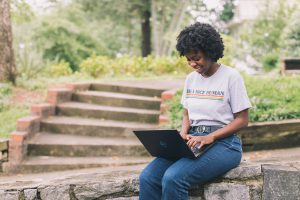 woman using a laptop outdoors