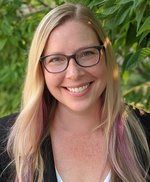 Jennifer Dale photo - young blond woman with glasses, smiling.