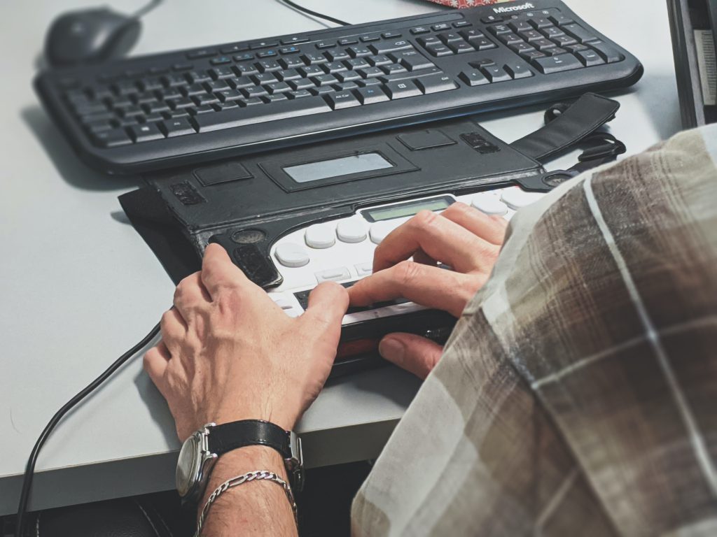 an individual using an assistive technology device