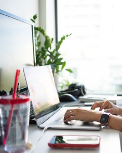 an individual using a laptop computer