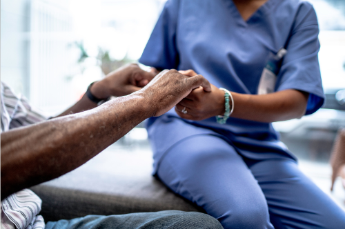 a medical professional helping a patient