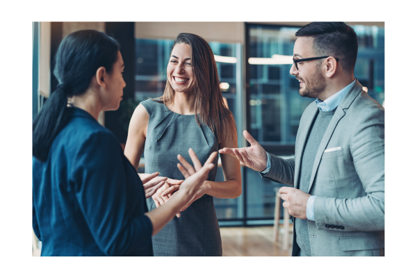 three professionally dressed individuals talking